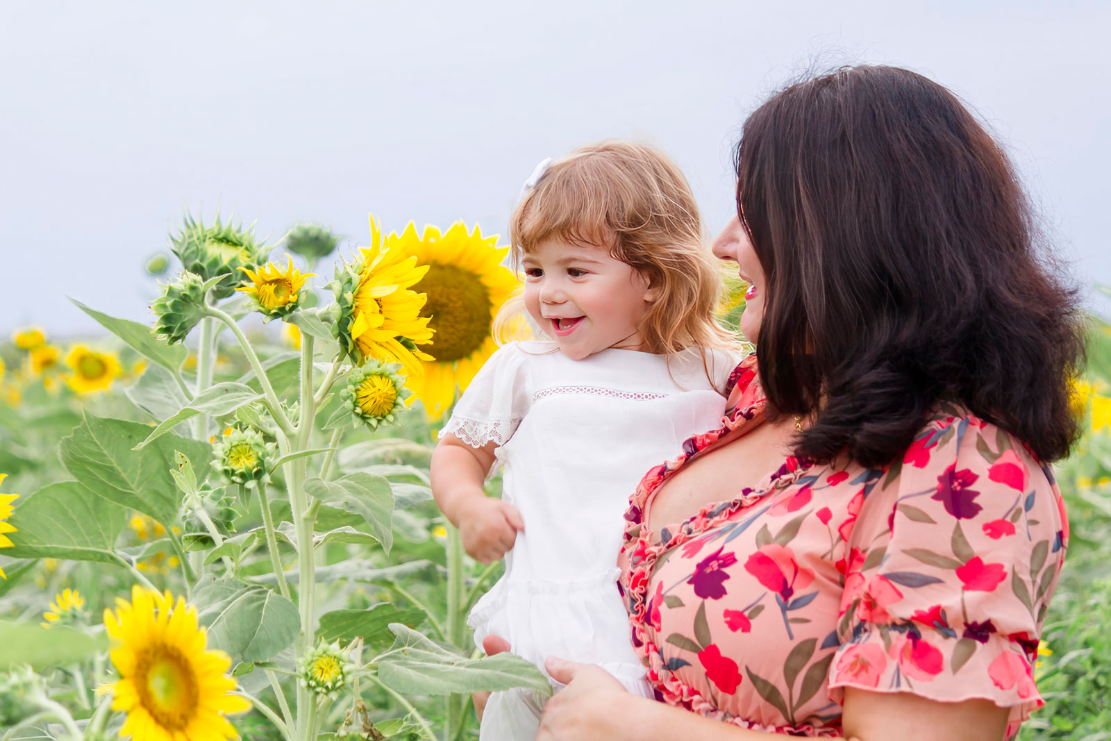 Mom and daughter admiring the sunflower at the sunflower fields in Belcher LA