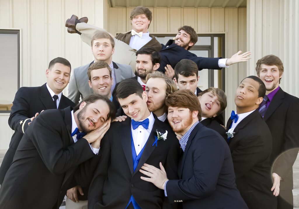 groom with groomens on the steps being silly at Rose Park Baptist in Shreveport, LA