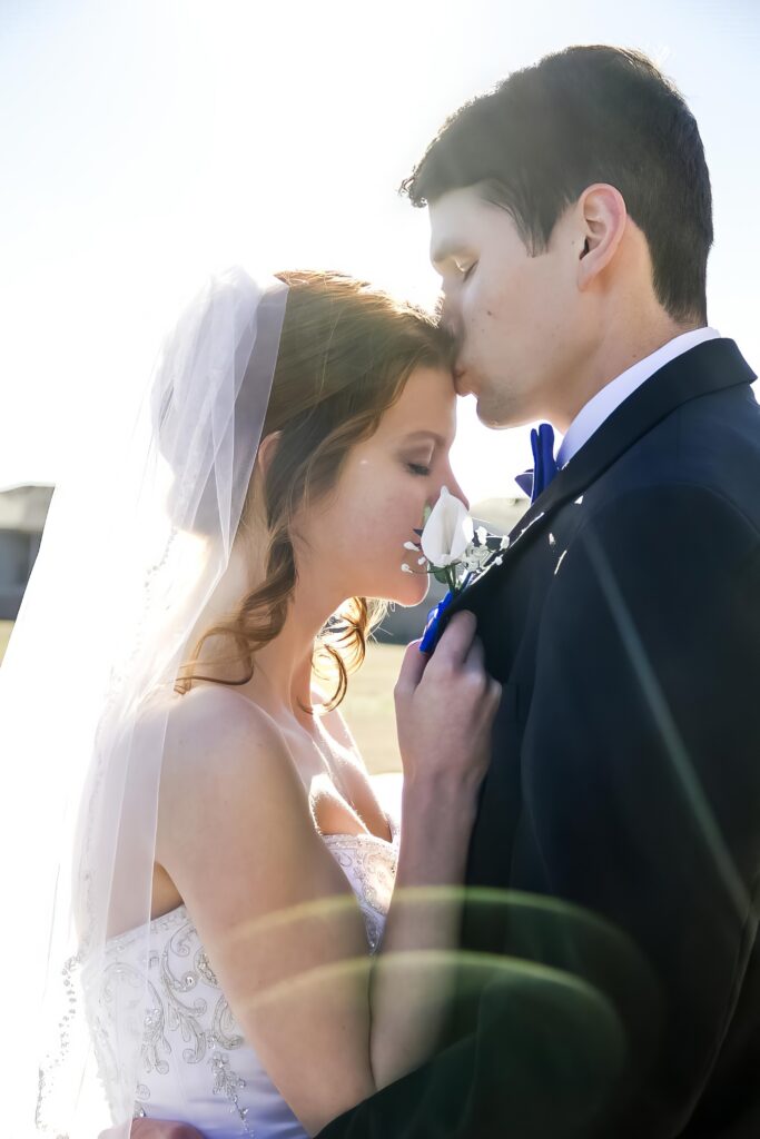 bride and groom loving on each other in Shreveport, LA