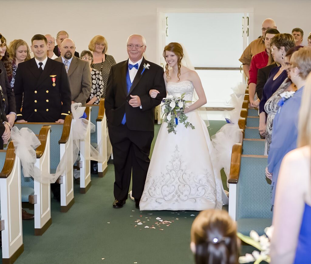 bride walking down the aisle with her father at Rose Park Baptist in Shreveport, LA