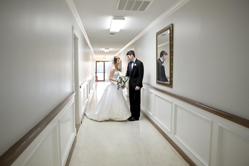 groom and bride in the hallway at Rose Park Baptist in Shreveport, LA