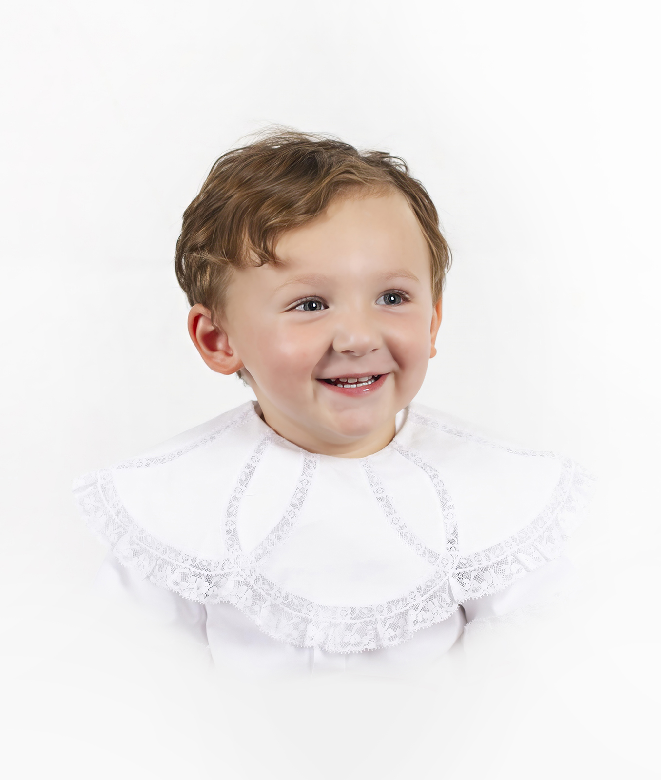 little boy toddler smiling looking left during a heirloom portrait home studio session in bossier city, la