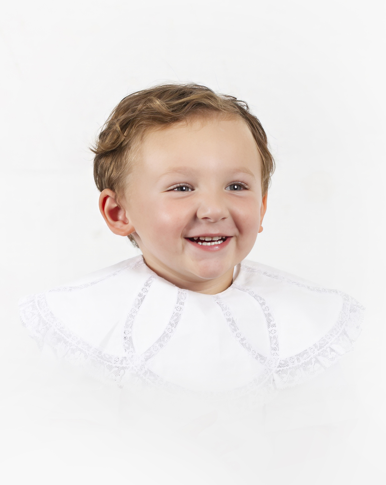 little boy toddler smiling looking left during a heirloom portrait home studio session in bossier city, la