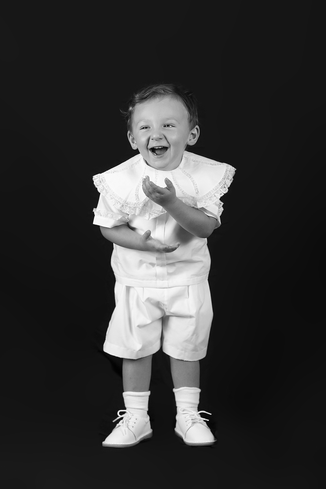 little boy toddler laughing during personality portrait home studio session in bossier city, la