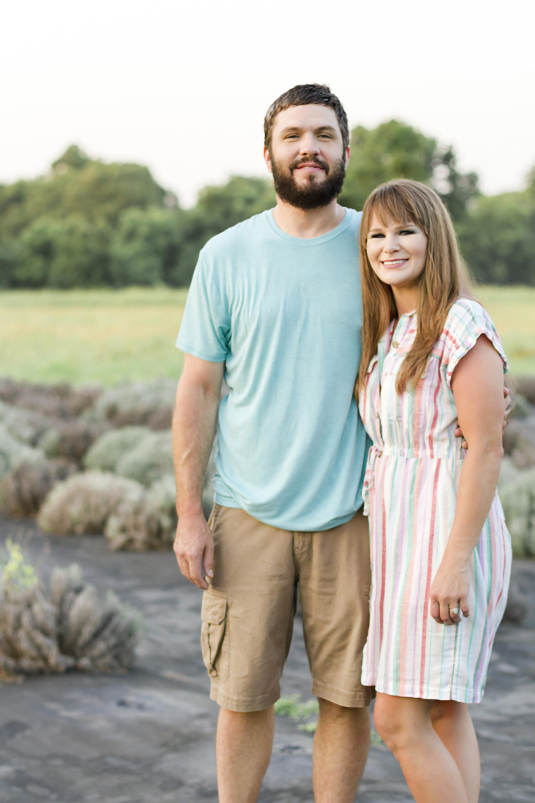 mom and dad aka husband and wife smiling at the Dixie Farm Lavender in Shreveport, LA