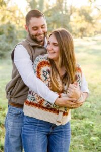 couples embracing each other and holding each other while laughing and smiling at Red River Wildlife Refuge Center in Bossier City, LA